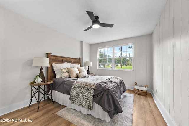 bedroom with hardwood / wood-style flooring and ceiling fan