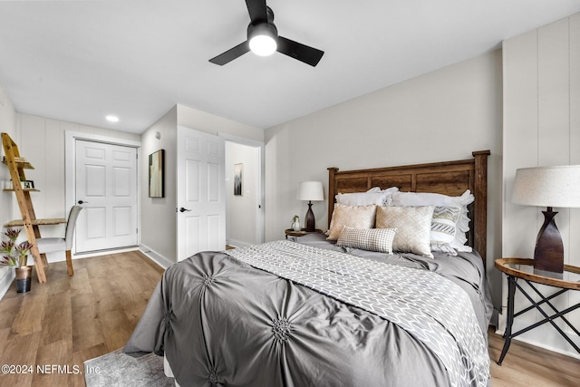 bedroom featuring ceiling fan and light hardwood / wood-style floors