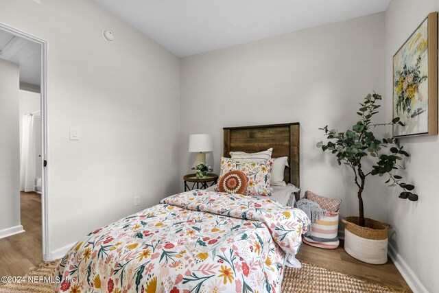 bedroom with wood-type flooring