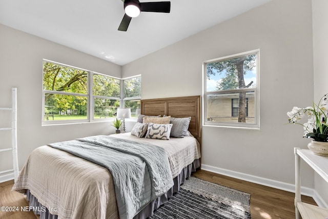 bedroom featuring wood-type flooring, lofted ceiling, and ceiling fan