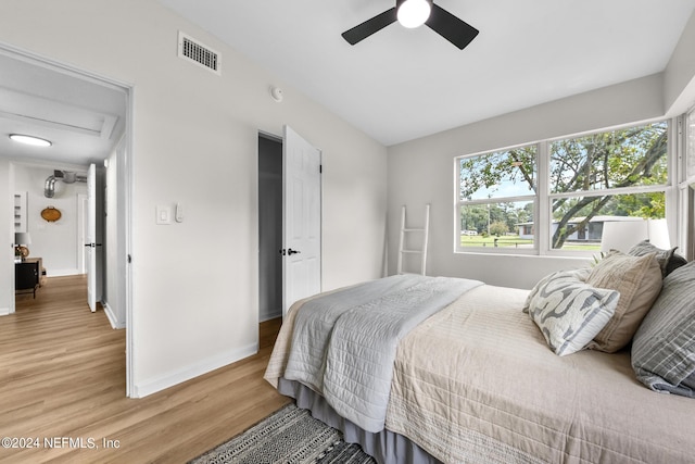 bedroom with hardwood / wood-style flooring and ceiling fan