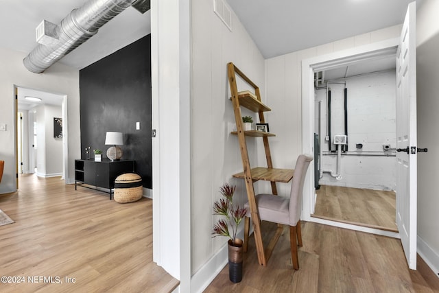 corridor featuring light hardwood / wood-style floors