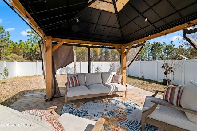 view of patio with a gazebo, an outdoor hangout area, and a deck