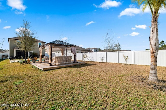 view of yard featuring a gazebo, an outdoor hangout area, and a patio