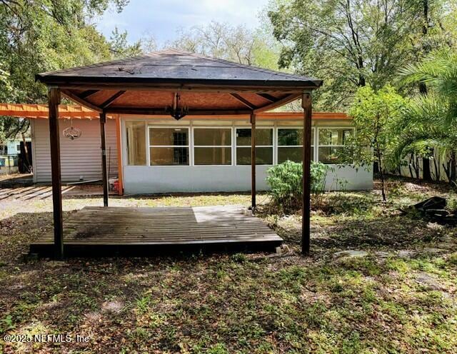 rear view of house with a deck