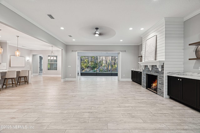 1351 Weaver Glen Rd, Jacksonville, FL 32223 - living area with ornamental molding, a high end fireplace, visible vents, and light wood finished floors