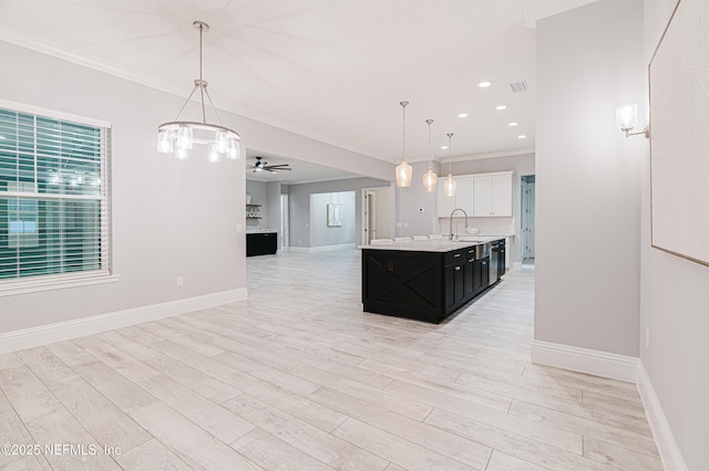 1351 Weaver Glen Rd, Jacksonville, FL 32223 - kitchen with open floor plan, light countertops, a kitchen island with sink, and decorative light fixtures