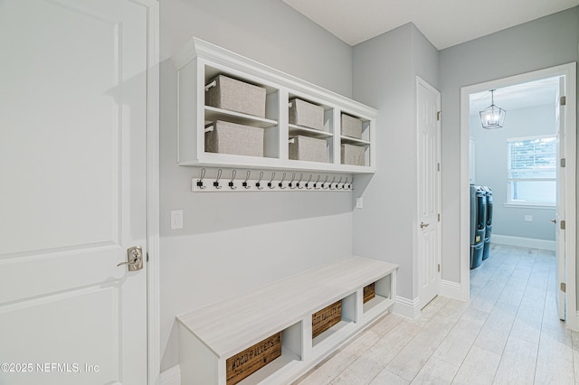 1351 Weaver Glen Rd, Jacksonville, FL 32223 - mudroom with light wood-type flooring, an inviting chandelier, and baseboards