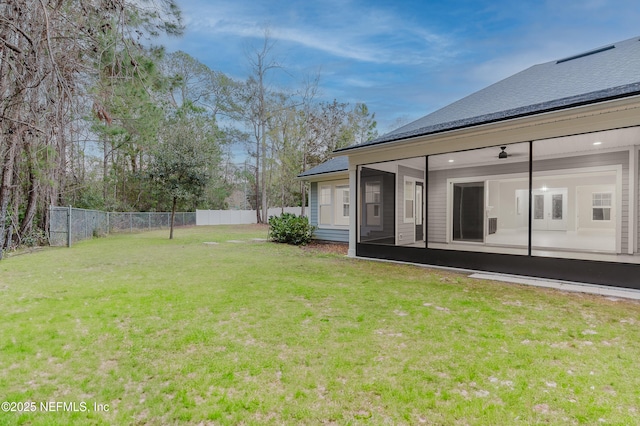 1351 Weaver Glen Rd, Jacksonville, FL 32223 - view of yard with a sunroom, fence, and a ceiling fan