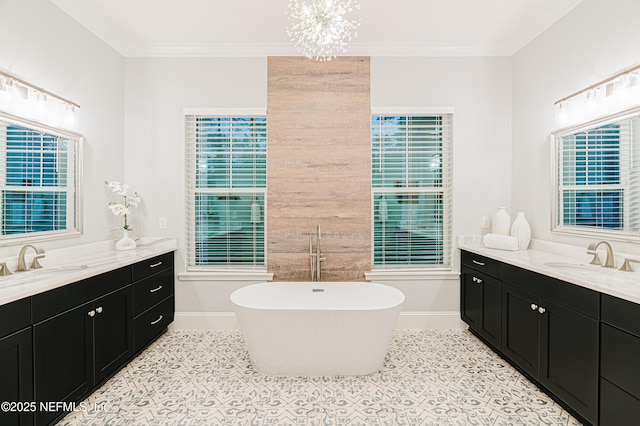 1351 Weaver Glen Rd, Jacksonville, FL 32223 - full bath with a freestanding tub, two vanities, a sink, and crown molding