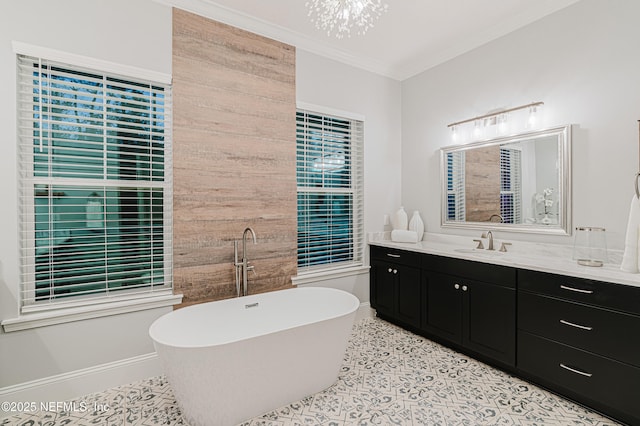1351 Weaver Glen Rd, Jacksonville, FL 32223 - bathroom featuring ornamental molding, a soaking tub, vanity, and baseboards