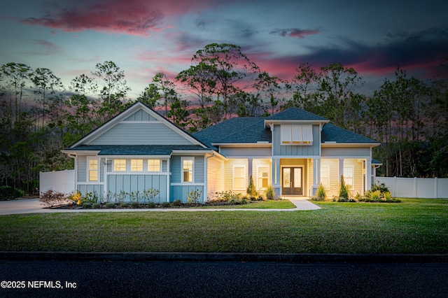 1351 Weaver Glen Rd, Jacksonville, FL 32223 - view of front of home with a front lawn, board and batten siding, and fence