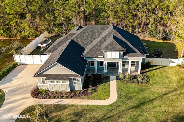 1351 Weaver Glen Rd, Jacksonville, FL 32223 - view of front of property with fence private yard, a front lawn, and roof with shingles