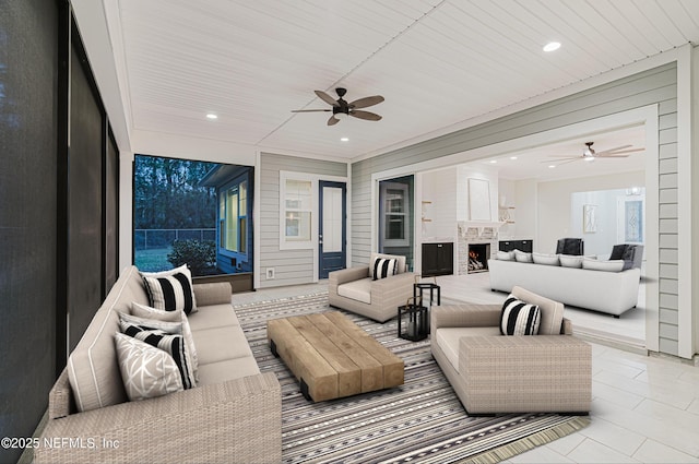 1351 Weaver Glen Rd, Jacksonville, FL 32223 - living room featuring a warm lit fireplace, ceiling fan, light tile patterned floors, and recessed lighting