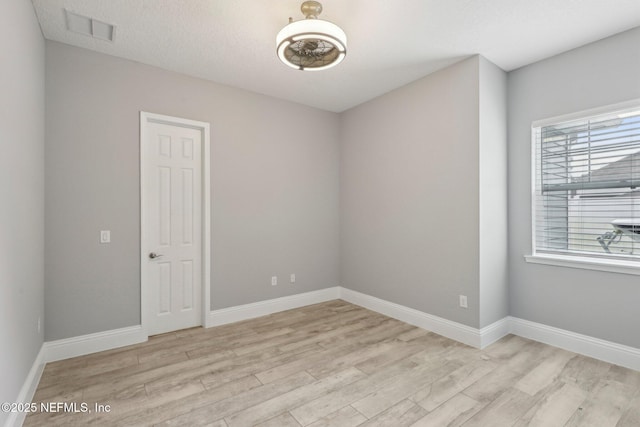 1351 Weaver Glen Rd, Jacksonville, FL 32223 - spare room with light wood-style floors, baseboards, visible vents, and a textured ceiling