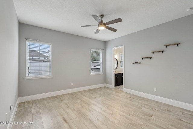 1351 Weaver Glen Rd, Jacksonville, FL 32223 - spare room with a healthy amount of sunlight, light wood-style floors, ceiling fan, and baseboards