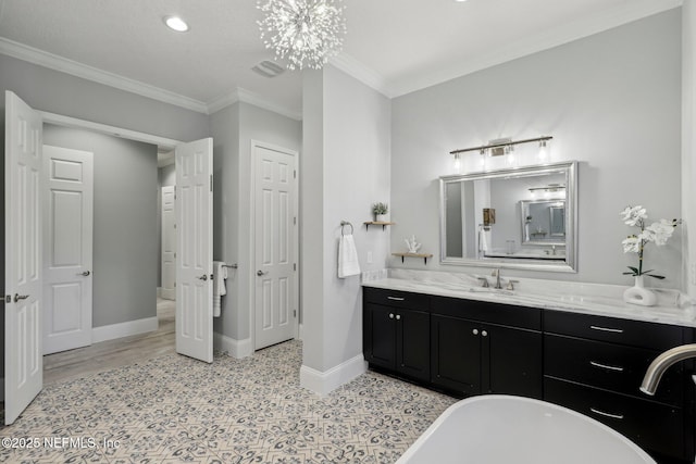1351 Weaver Glen Rd, Jacksonville, FL 32223 - bathroom with baseboards, visible vents, ornamental molding, a freestanding bath, and vanity