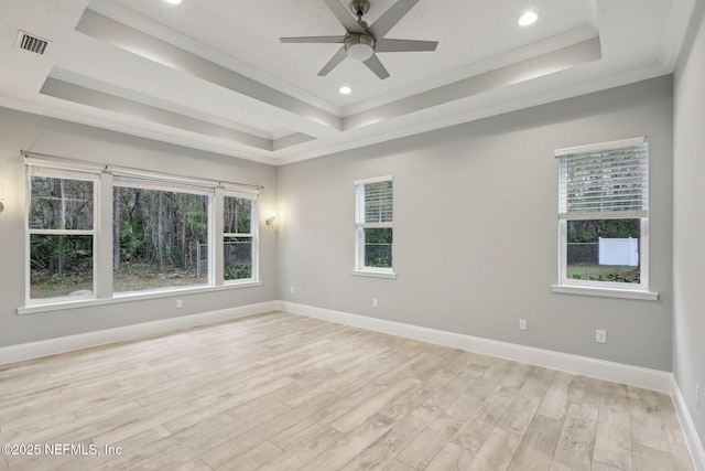 1351 Weaver Glen Rd, Jacksonville, FL 32223 - unfurnished room with visible vents, baseboards, a tray ceiling, light wood finished floors, and crown molding