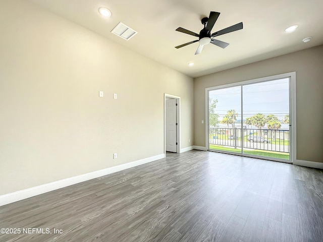 empty room featuring hardwood / wood-style floors and ceiling fan