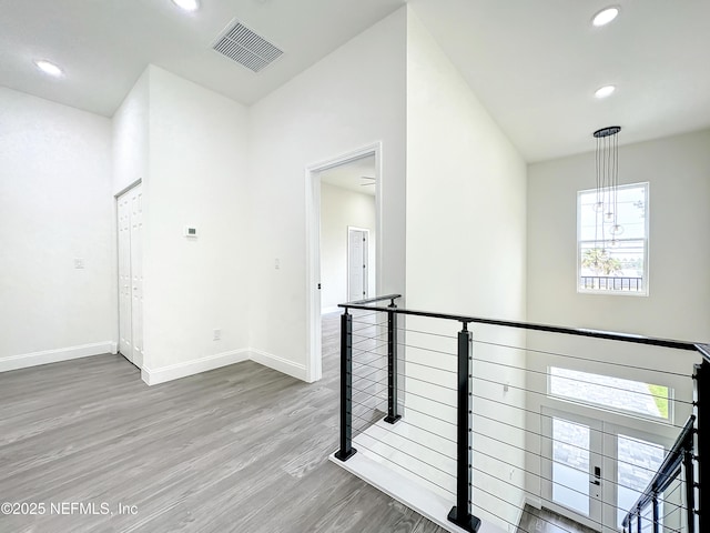 hallway featuring hardwood / wood-style flooring