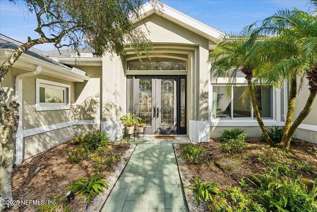 entrance to property featuring french doors