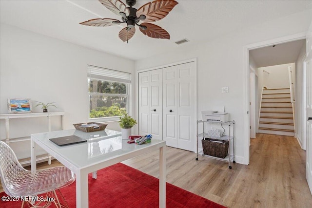 office featuring ceiling fan and light hardwood / wood-style flooring