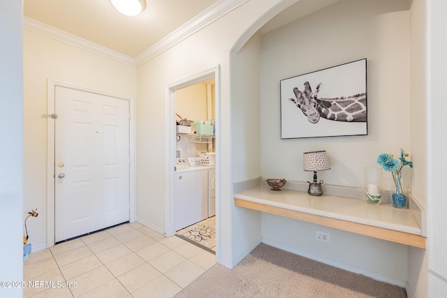 12700 Bartram Park Blvd Unit 2333, Jacksonville, FL 32258 - entryway with light tile patterned floors, baseboards, arched walkways, ornamental molding, and washing machine and clothes dryer
