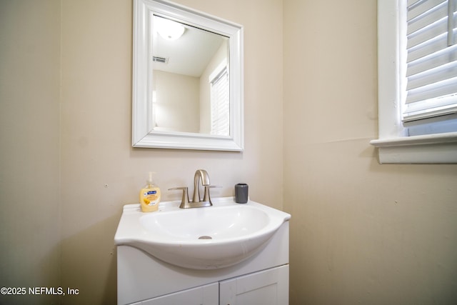 bathroom with vanity and visible vents