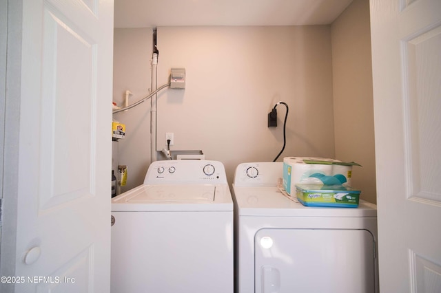 clothes washing area featuring laundry area and independent washer and dryer