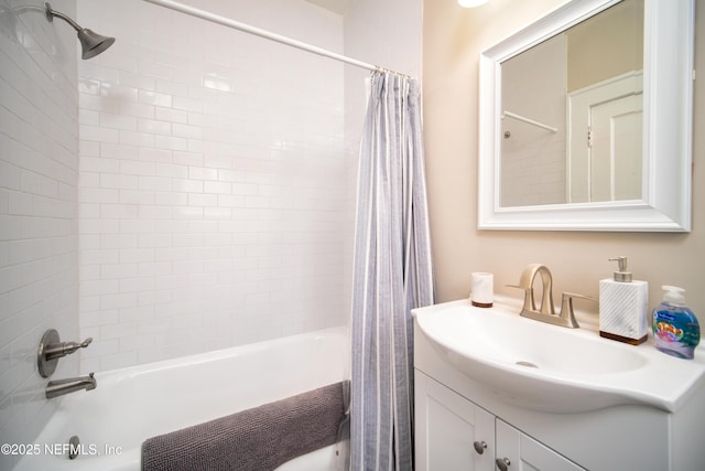 bathroom with shower / tub combo and vanity