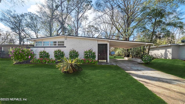 view of property exterior featuring a lawn and a carport