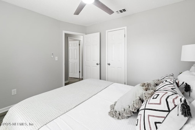 bedroom with visible vents, ceiling fan, and baseboards