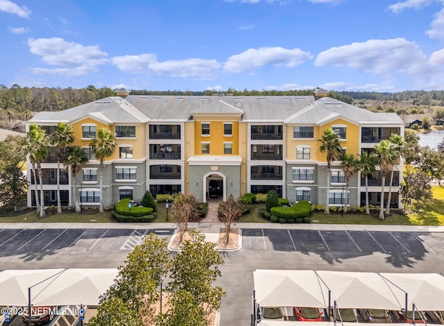 view of property featuring uncovered parking