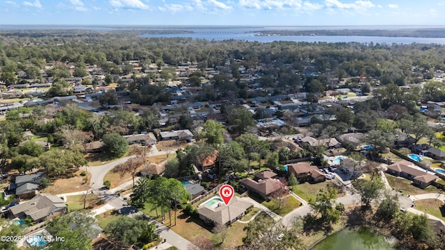 drone / aerial view featuring a water view and a residential view