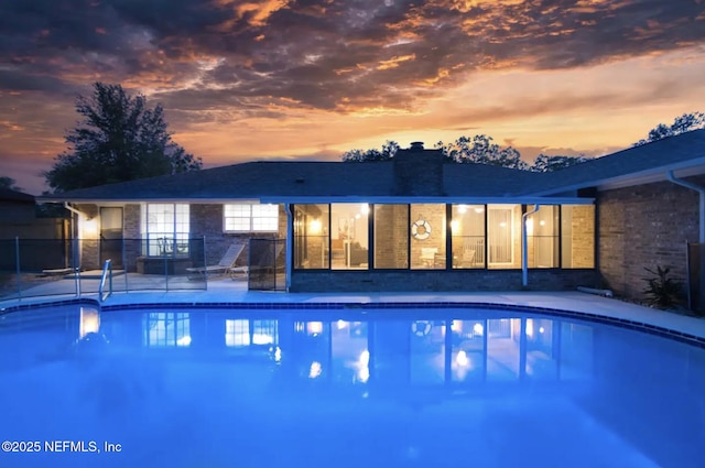 view of swimming pool with a patio area and a fenced in pool