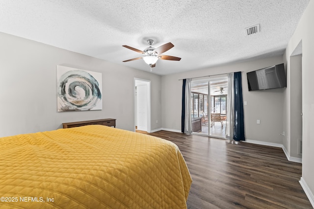 unfurnished bedroom featuring access to exterior, visible vents, dark wood finished floors, and baseboards