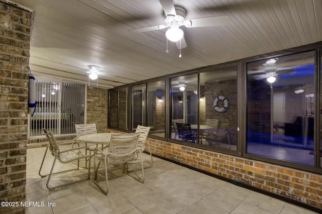 view of patio / terrace with ceiling fan and outdoor dining space