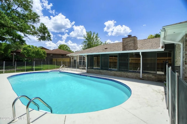 view of pool featuring a patio, a fenced in pool, and fence