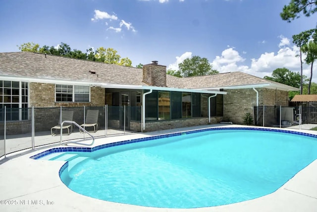 view of pool with a fenced in pool, a patio, and fence