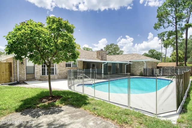 view of swimming pool with a fenced in pool, a patio, and fence