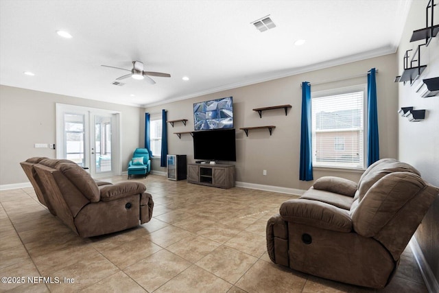 tiled living room with french doors, ceiling fan, and crown molding