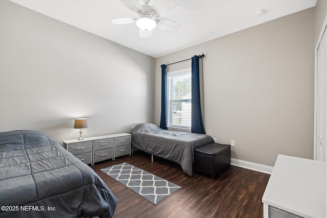 bedroom featuring dark wood-type flooring and ceiling fan