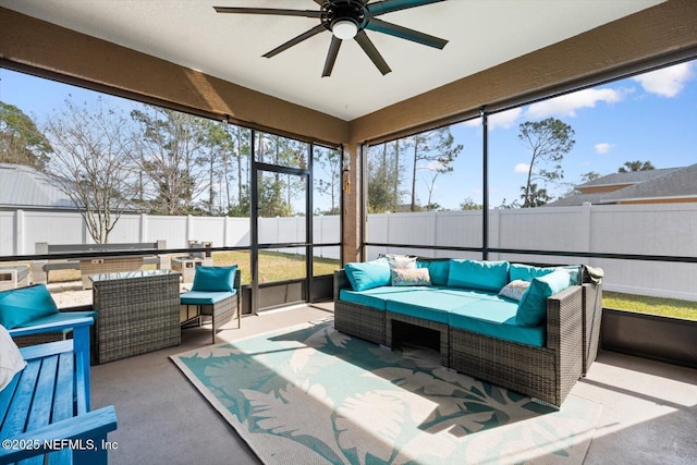 sunroom featuring ceiling fan