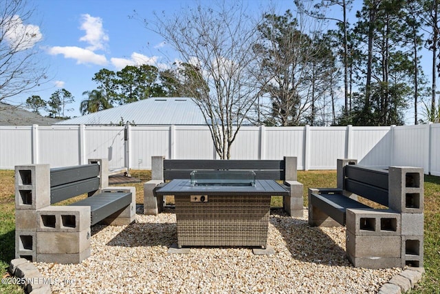 view of patio / terrace with an outdoor fire pit