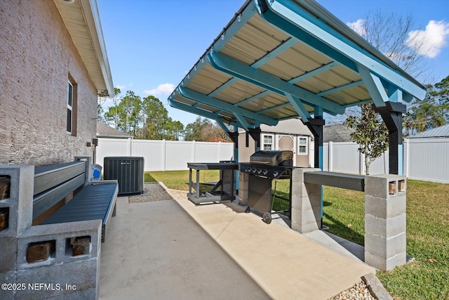 view of patio with an outbuilding and central air condition unit