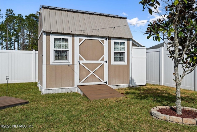 view of outbuilding with a lawn