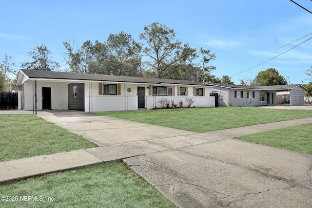 ranch-style home with a carport and a front lawn