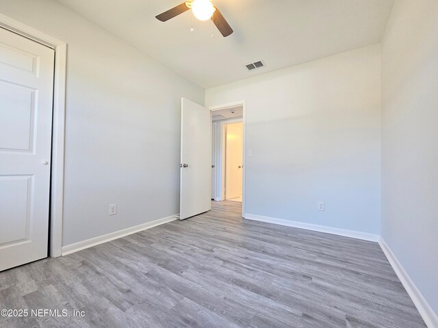 2434 Leonid Rd, Jacksonville, FL 32218 - unfurnished bedroom featuring ceiling fan and light wood-type flooring