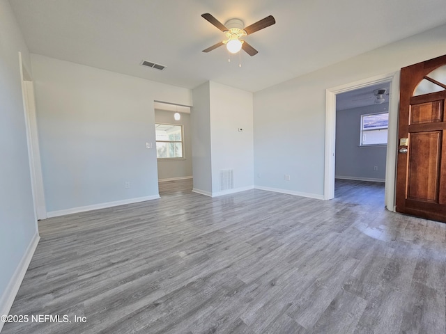 2434 Leonid Rd, Jacksonville, FL 32218 - spare room featuring wood-type flooring and ceiling fan