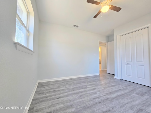 2434 Leonid Rd, Jacksonville, FL 32218 - unfurnished bedroom featuring ceiling fan, light wood-type flooring, and a closet